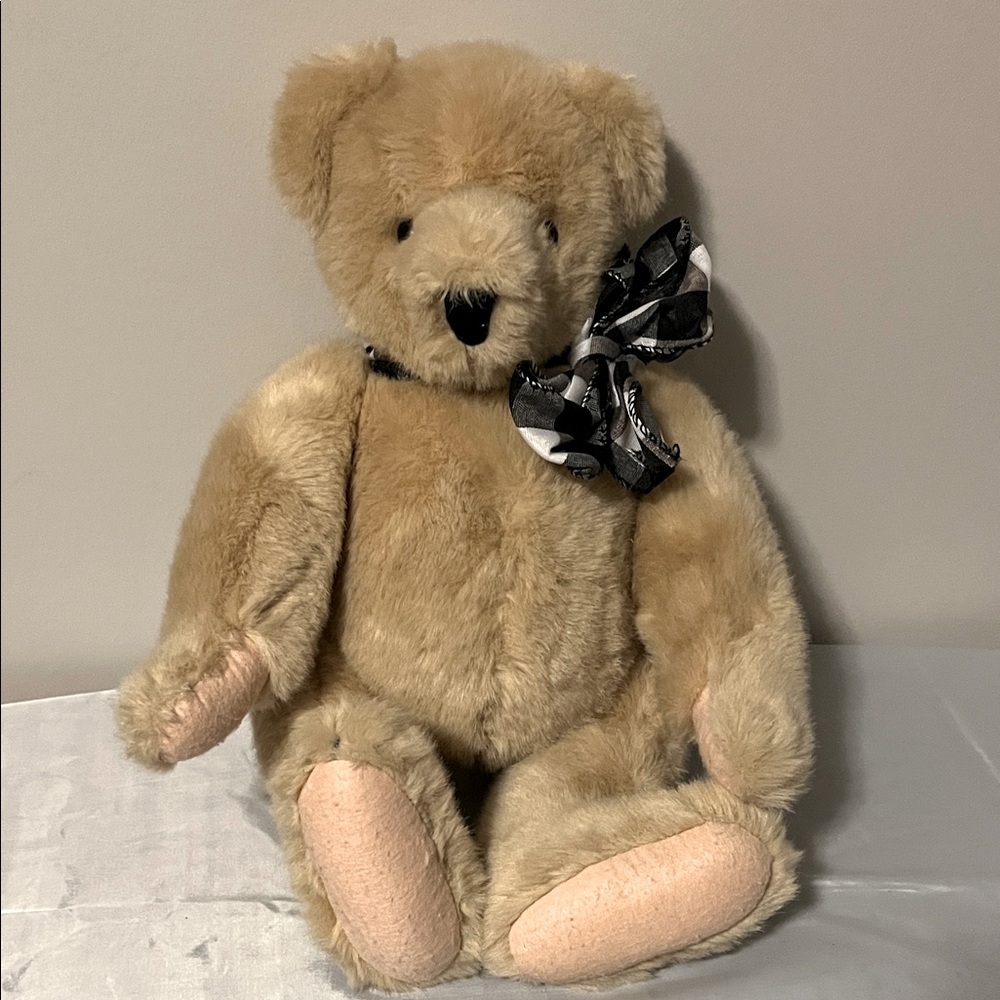 Collectible Tan Teddy Bear with Black Bow